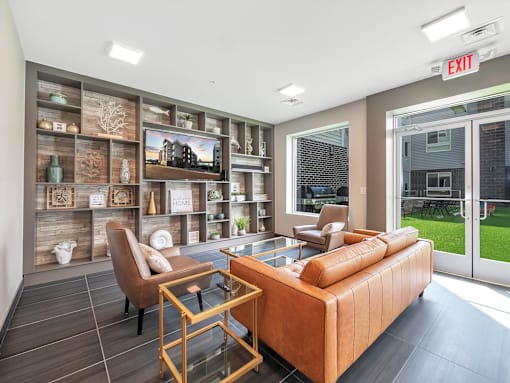A living room with a brown couch, a chair, and a coffee table.