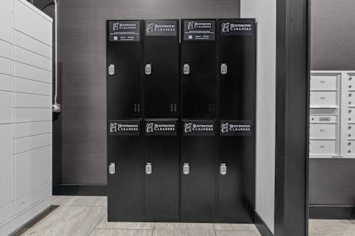 A row of black filing cabinets with the words "Burntouch Cleaners" written on them.