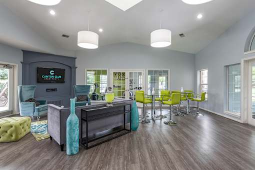 A modern living room with a TV and a bar area.