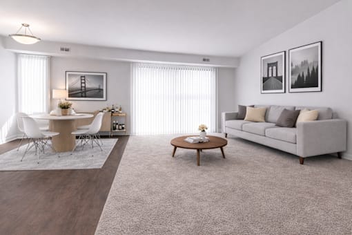 A modern living room with a dining area and a couch.