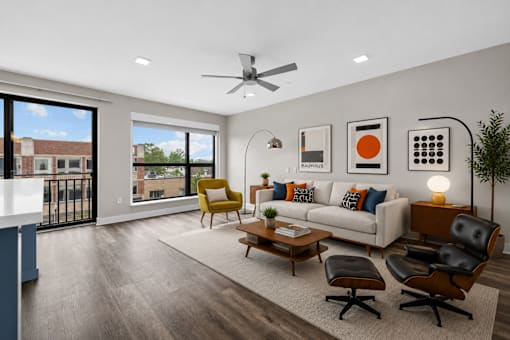 A modern living room with a yellow chair and a white couch.