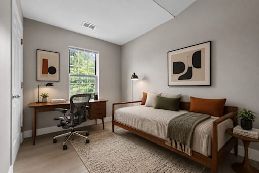 Modern bedroom with workspace and natural light at Village Club of Farmington Hills Apartments, Michigan, 48331