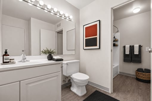Modern bathroom with white vanity and walk-in shower at Village Club of Farmington Hills Apartments, Farmington Hills, MI 48331