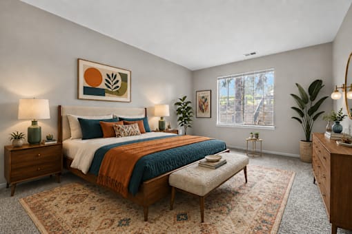 Bright bedroom with midcentury modern decor at Village Club of Farmington Hills Apartments, Farmington Hills, MI
