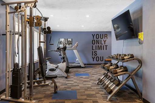 A gym with a sign that says "your only limit is you".