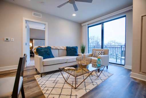 a spacious living room with city views