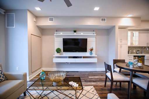 a living room with a tv and a table