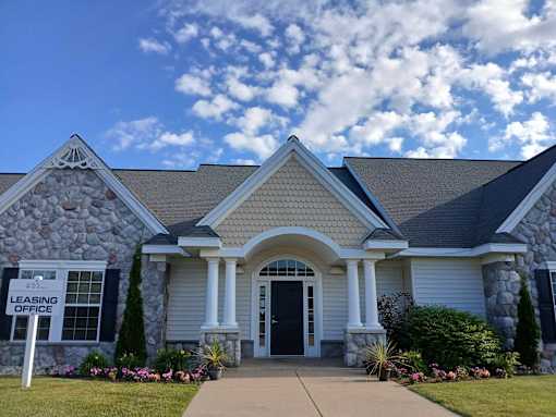 A house with a sign that says "Leasing Office".