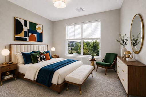 A bedroom with a large bed, a chair, and a mirror.