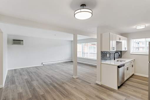 A kitchen area with a sink, stove, and cabinets at The Park on 13 Apartments - Royal Oak, MI Apartments, Michigan, 48073