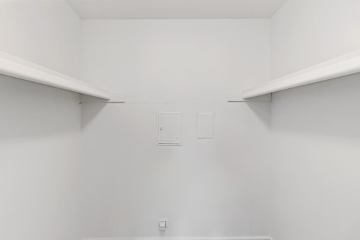 A white pantry with two shelves and a door. at The Park on 13 Apartments - Royal Oak, MI Apartments, Michigan, 48073