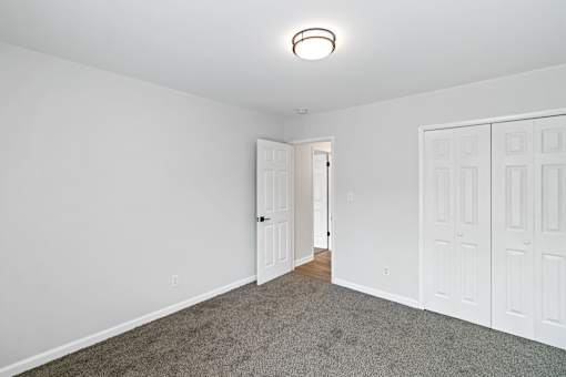 A room with white walls and a carpeted floor at The Park on 13 Apartments - Royal Oak, MI Apartments, Michigan
