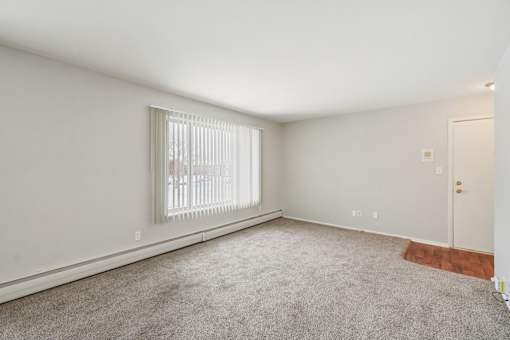 A room with a window and a door.