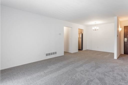 a large empty room with a chandelier