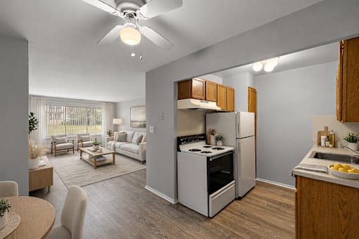 A modern kitchen with a refrigerator, stove, and sink.