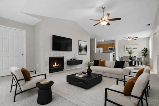 A modern living room with a fireplace and a television.
