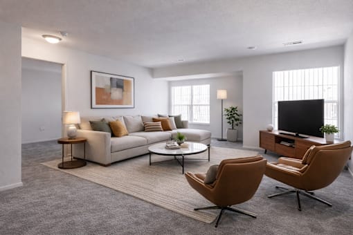 A modern living room with a grey carpet and a white sofa.