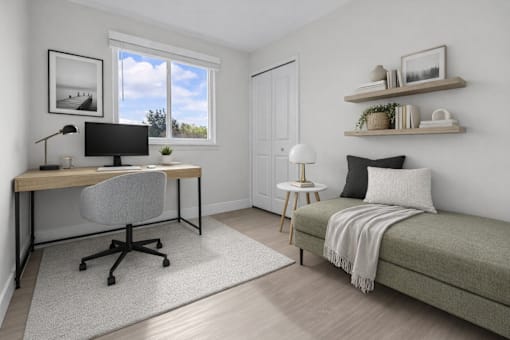A room with a desk, chair, and bed.