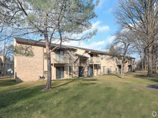 a building with a grassy area in front of it