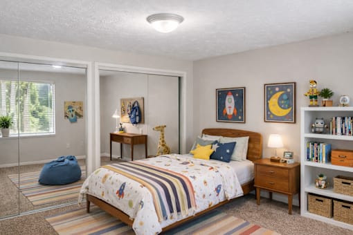 A bedroom with a bed, a nightstand, a window, a chair, a shelf, and a rug.