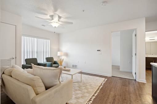 an open living room with a couch and a coffee table