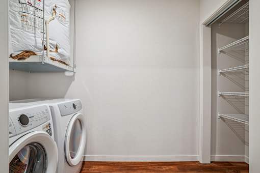 A laundry room with a washer and dryer.