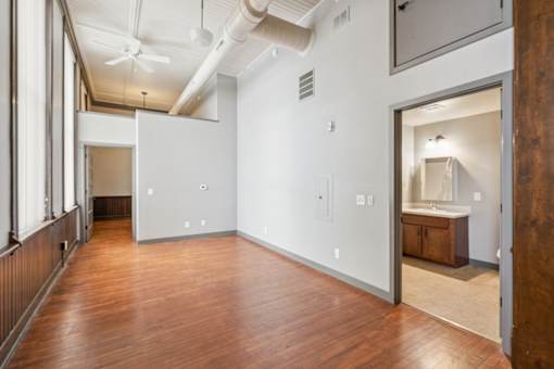 A room with a wooden floor and white walls.