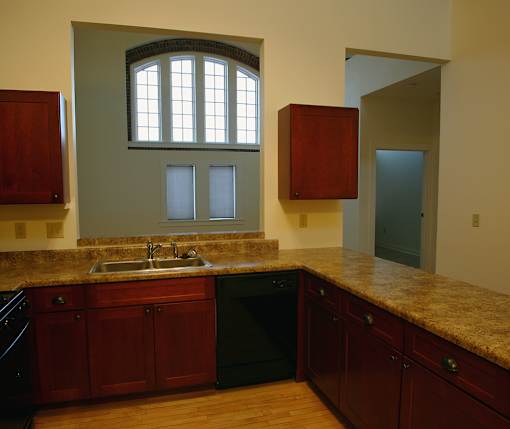 A kitchen with a sink and a window.
