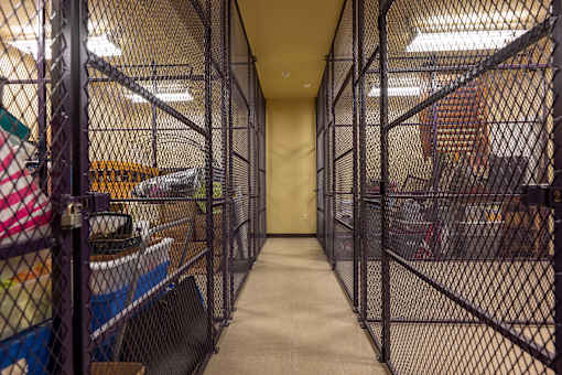 A long hallway with a fence on both sides.