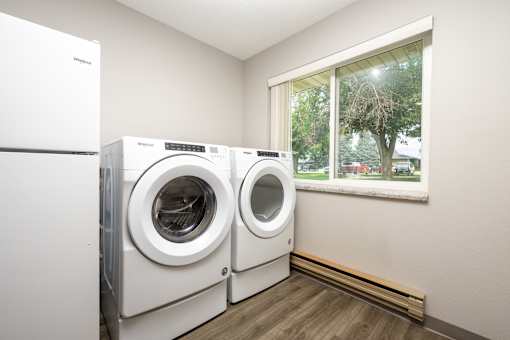 A laundry room with a washer and dryer in it.