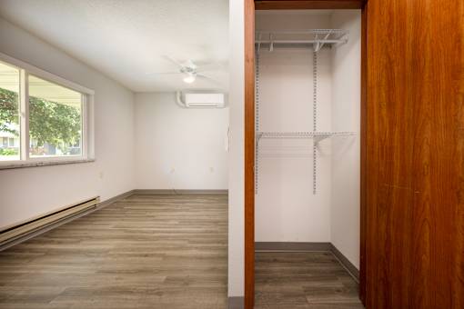 A room with a sliding door and a window.
