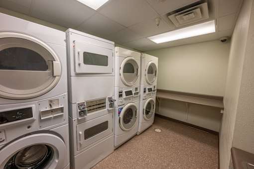 A row of washing machines in a public laundromat.