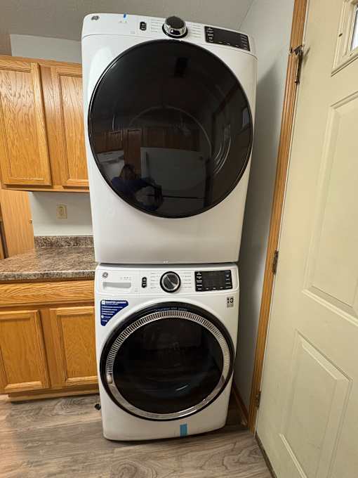 Two white ovens are installed in a kitchen.
