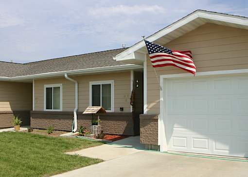 A house with a flag on the roof.