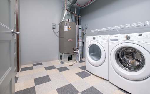 A laundry room with a washer and dryer.