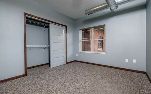 A room with a door and a window.