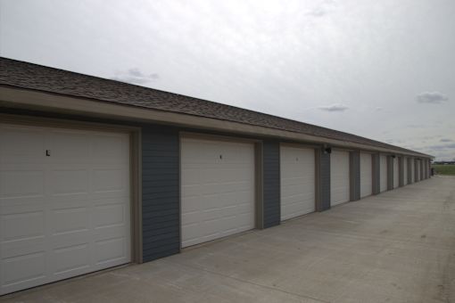 A long row of garage doors are closed.