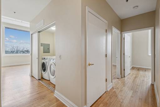 A laundry room with a washer and dryer in it.