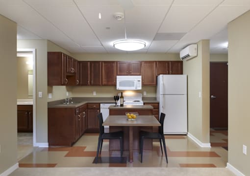 a kitchen with wooden cabinets and a white refrigerator