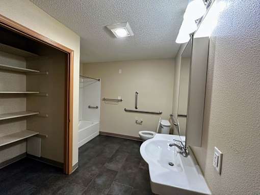 a small bathroom with a toilet sink and bathtub