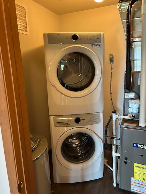 Two front loading washing machines in a laundry room.