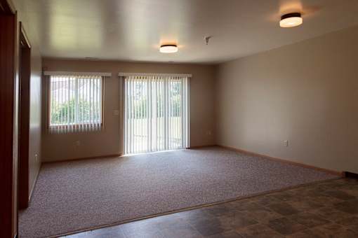 A living room in a two bedroom, one story apartment.
