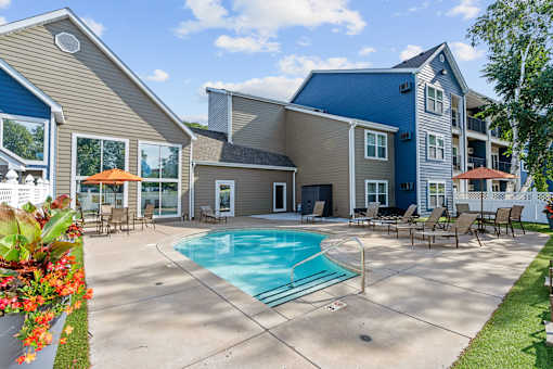 A large house with a pool in the backyard.