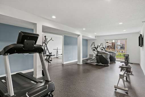 Fitness center with weight lifting equipment and cardio equipment at Cityscape, St Louis Park, MN, 55416