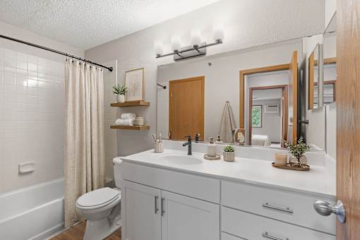 Bathroom in a newly renovated apartment home at Park Pointe Apartments in St. Louis Park, MN 55426