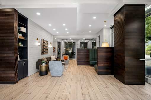 A modern interior with wood floors and furniture.
