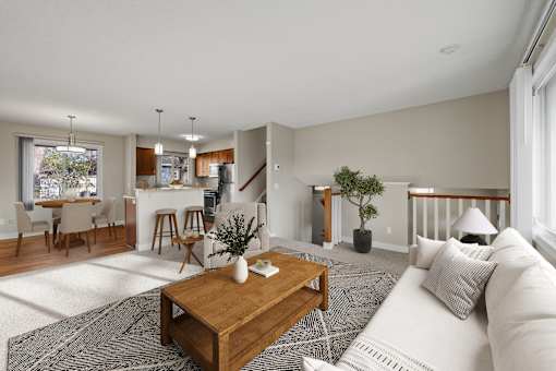 Living room, dining, and kitchen of the Duplex at Beach South at the Lake in Robbinsdale, MN