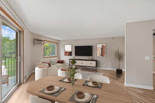 Kitchen, living room, and dining room in a newly renovated apartment home at Park Pointe Apartments in St. Louis Park, MN 55426