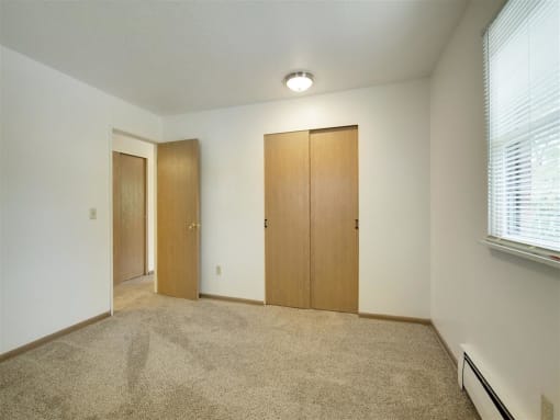Northeast Villas Apartments in Fridley, MN Carpeted Bedroom