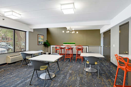 A room with a table and chairs.